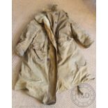 A vintage sheep skin lined canvas long coat, possibly a driving coat,