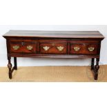 A late George III and later oak dresser with three drawers on turned legs,