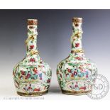 A pair of 19th century Chinese porcelain, Canton famille rose bottle vases,
