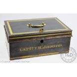 A Victorian tin deed box titled in gilt 'Captn T H Johnston', rectangular form, vacant interior,