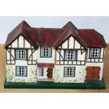 Two early / mid 20th century dolls houses Provenance: Yeaton Peverey Hall