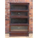 A Globe Wernicke oak four section bookcase, with label to two sections, on plinth base, 149.