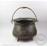 An Art Nouveau copper and brass cauldron shaped coal bucket / jardiniere,