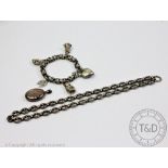 A Victorian silver coloured bracelet with attached heart shaped,