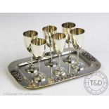 A Thailand sterling silver liqueur set, comprising six cups, 8cm high, and a rectangular tray,