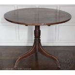 A George III oak circular occasional table on tripod base,