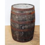 A coopered oak barrel, 86cm H, with an Indonesian metal mounted hardwood coffee table,