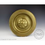 A 17th/18th century Nuremberg brass alms dish,