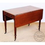 An early 19th century mahogany Pembroke table, with drawer, on turned and tapered legs,