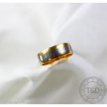 A 22ct gold and white metal band,