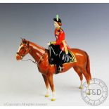 A Beswick model of Queen Elizabeth II mounted on Imperial Trooping the Colour in 1957,