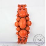 A Victorian coral bracelet, designed as a central lozenge shaped, coral set cluster,