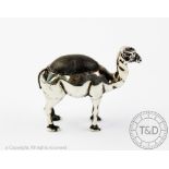 A silver novelty camel pin cushion, Sydney & Co, Birmingham 1906, modelled standing, 6cm long x 5.