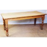 A Victorian style pine farmhouse kitchen table, with drawer, on turned legs,