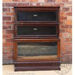 A Globe Wernicke oak three section bookcase, with label to two of the sections, on plinth base, 121.