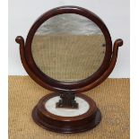 A William IV mahogany circular toilet / dressing table mirror, with marble inset circular base,