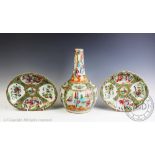 A 19th century Chinese porcelain Canton famille rose bottle vase, typically decorated with figures,