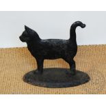 A cast iron boot scraper modelled as a cat, cast mark to base,