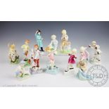 A set of twelve Freda Doughty for Royal Worcester months of the year figures,