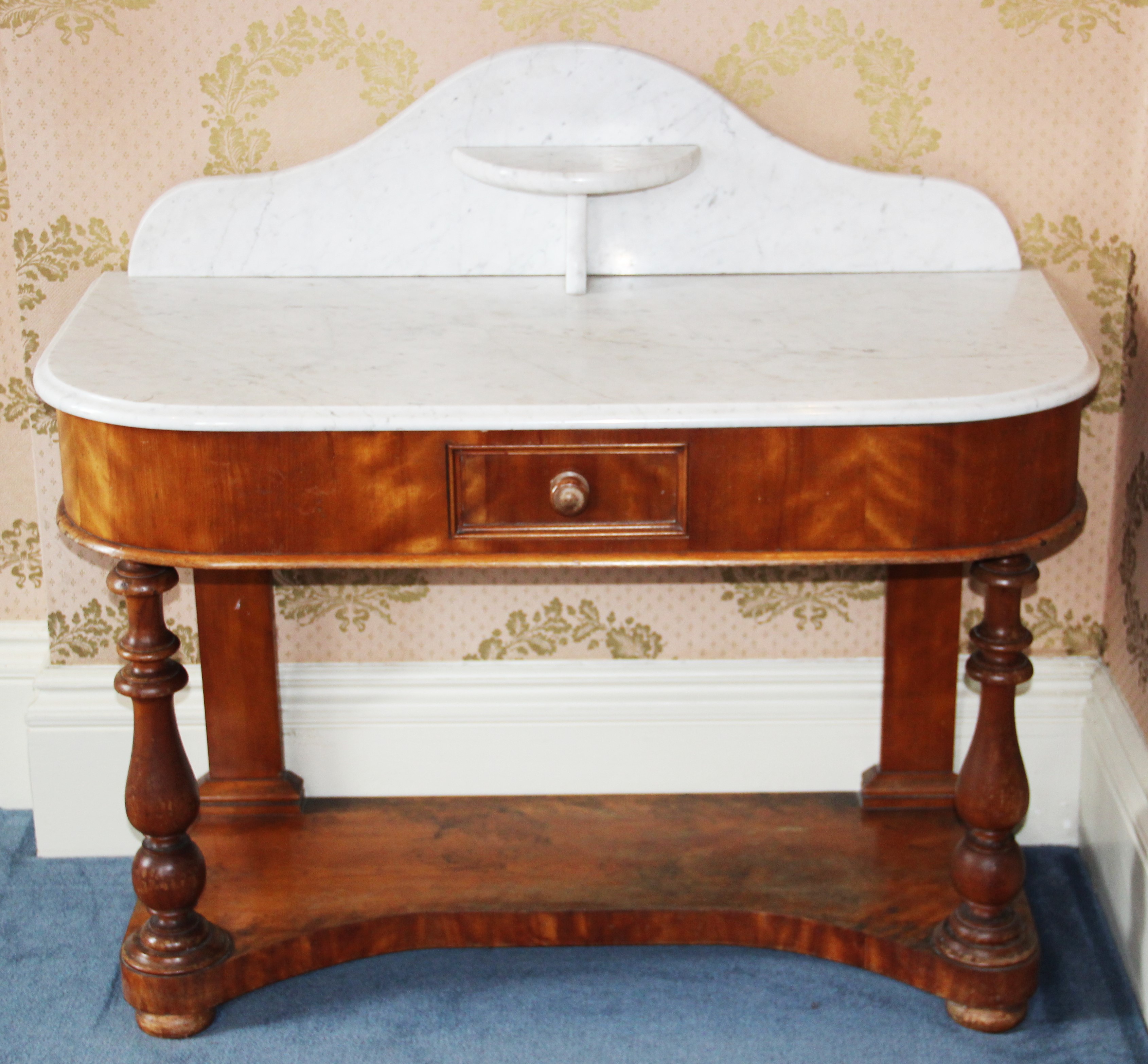 A Victorian marble top Duchess type wash table