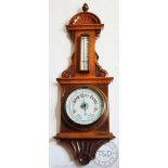 An Edwardian carved golden oak aneroid barometer, 77cm,