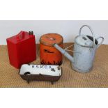 A Great Western Railway watering can, with a Shell Motor Spirit petol can and cap,