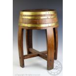 A 1930's French coopered barrel converted to a stool, 47cm high and a wall mounting hanging rack,