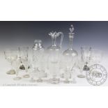 An Edwardian glass claret jug and near matching decanter and stopper, each initialled WRC,