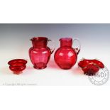 A selection of cranberry glass, to include; a lemonade jug, 19cm high, a water jug,