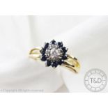 A diamond and sapphire cluster ring,