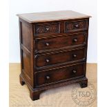 An oak chest, with two short and three long drawers, on bracket feet, 92cm H x 76cm W x 50cm D,