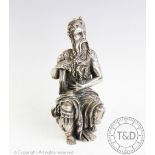 A white metal figure of Moses, modelled seated with flowing robes, wax filled, stamped '925', 14.