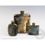 Three silver plated hip flasks including an Art Deco example, 9cm high,