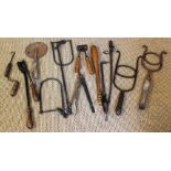 A selection of vintage equestrian and agricultural tools, to include two shire horse mouth openers,