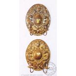 A part set of five 18th century style brass twin branch wall sconces with oval back plates,