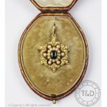 A Victorian tourmaline and untested pearl set brooch/pendant, designed as a stylised floral pendant,