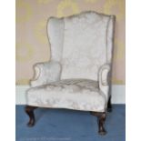 A George II style wingback arm chair Provenance: Yeaton Peverey Hall