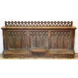 A late 19th century carved oak ecclesiastical panel, with two 'spires' to either side,