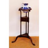 A 19th century style mahogany wash stand, with blue and white bowl and jug,