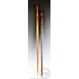 Two Tribal walking sticks, comprising; an East African example, possibly Tanzanian Makonde tribe,