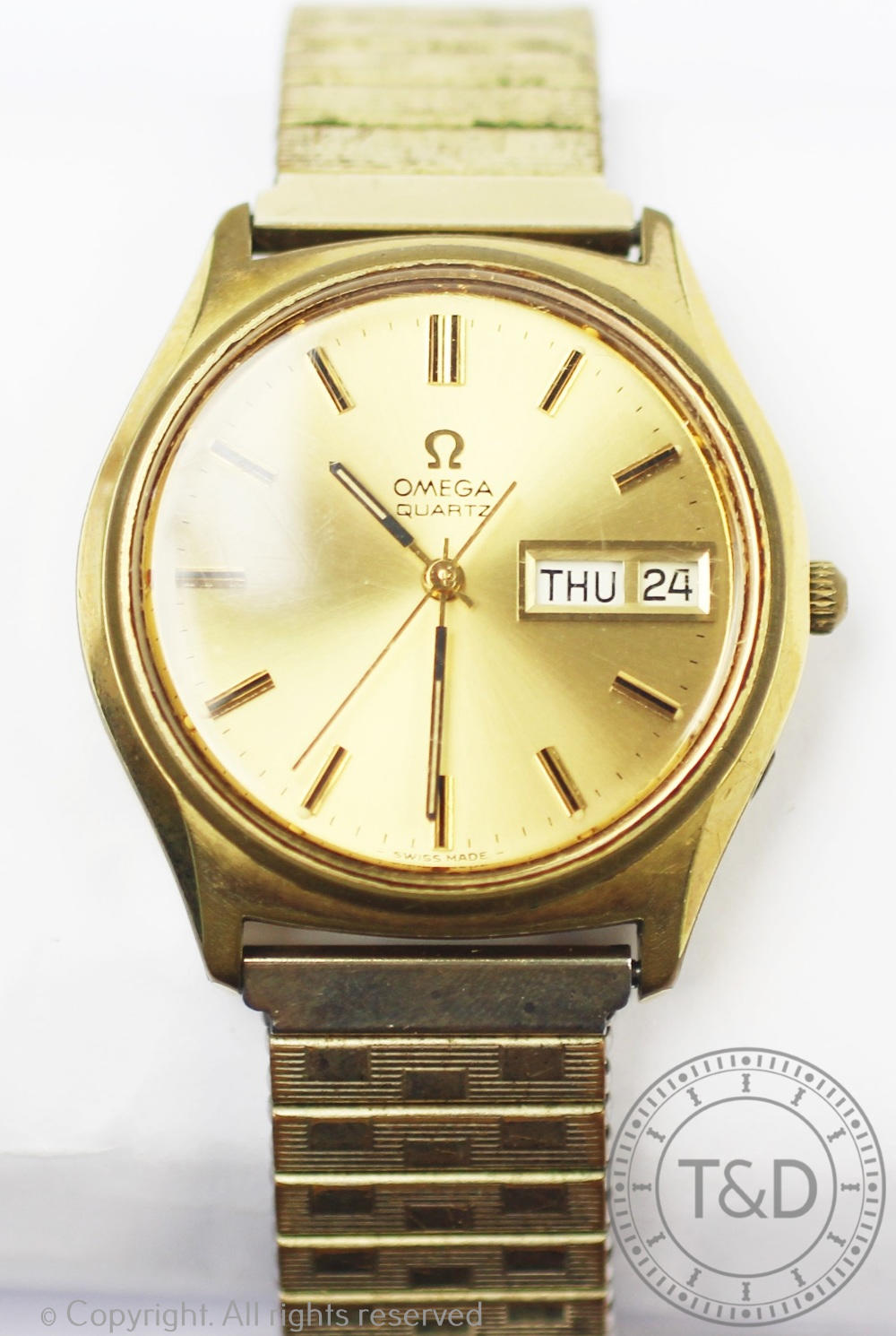 A gentlemans gold plated Omega wristwatch, baton dial with date and day apertures,