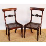 A set of five George IV carved rosewood dining chairs,
