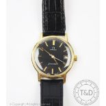 An Omega Seamaster wristwatch, the gold plated case enclosing black coloured dial with gilt batons,