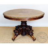 A Victorian green man style carved oak oval dining table, with three leaves,