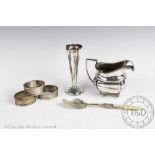 A selection of silver to include a cream jug, Thomas Edward Atkins, Birmingham 1912,