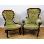 A near pair of Victorian carved walnut salon chairs, with button back green upholstery,