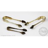 Three pairs of silver sugar tongs; a George IV example, London 1829, initialled 'EJ', 15cm long,