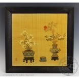 A pair of Chinese painted and printed textile panels, decorated with vases of flowers,