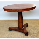 An Art Deco walnut circular centre table, with radially veneered top,