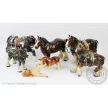 A collection of eight Shire horses, to include examples with harnesses and tack,